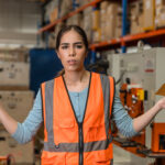 Female labor engineer showing dissatisfaction with salary received. employee industry worker unhappy less bonus cash pay